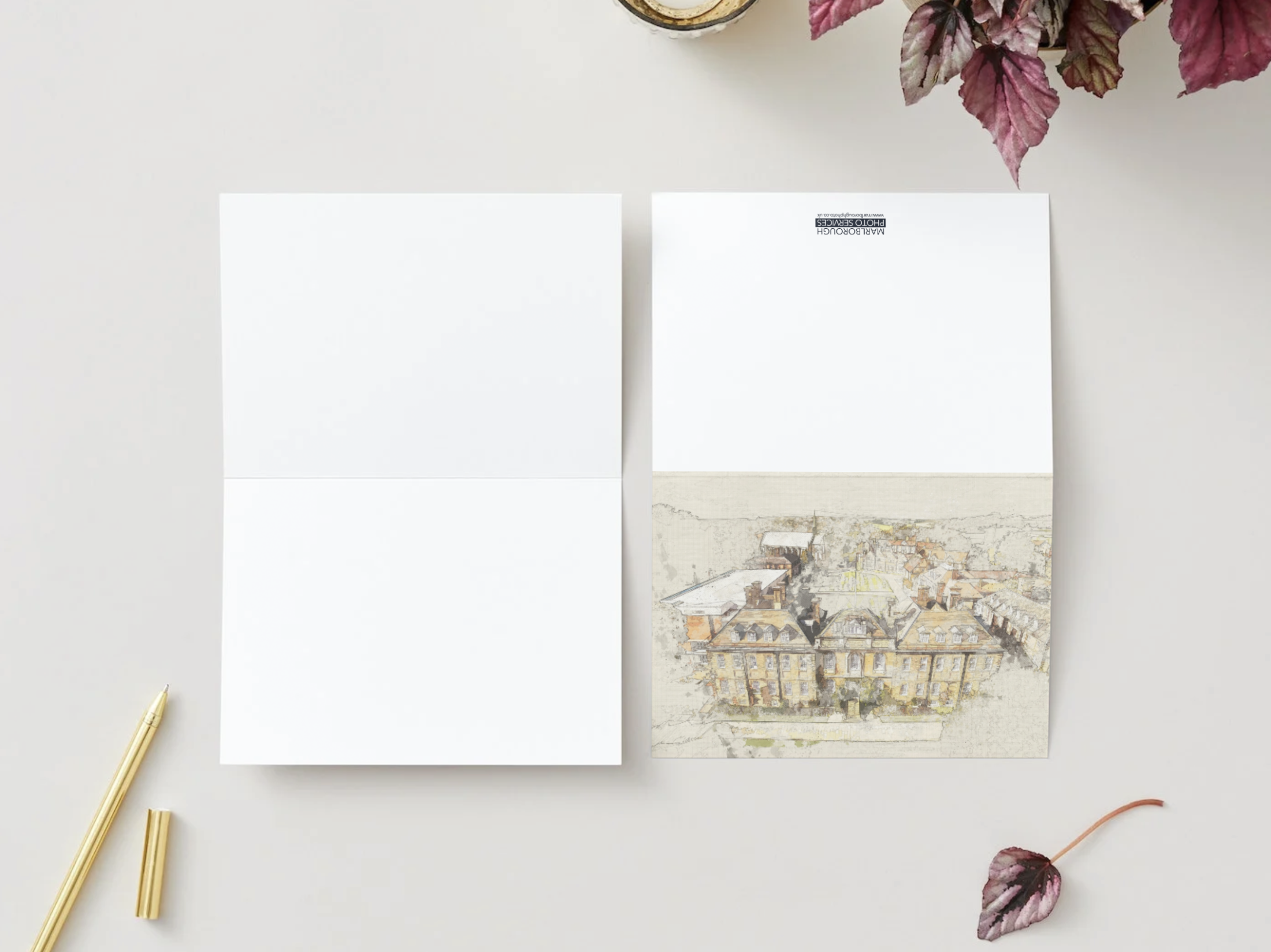 A Marlborough Photo greetings card opened flat alongside its envelope